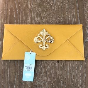 Gorgeous yellow clutch by mud pie